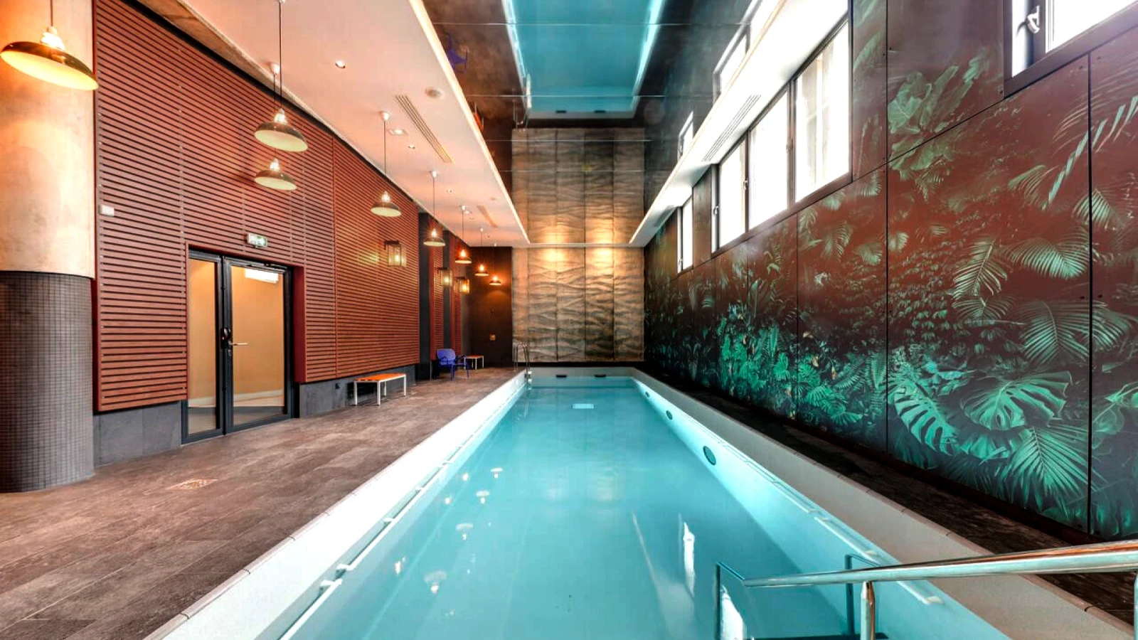 Indoor swimming pool at Novotel Gare de Lyon redesigned by Saguez & Dash